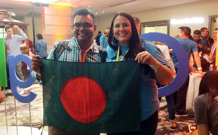 Local Guide @PavelSarwar with Googler @TraciC  holding Bangladesh flag.
