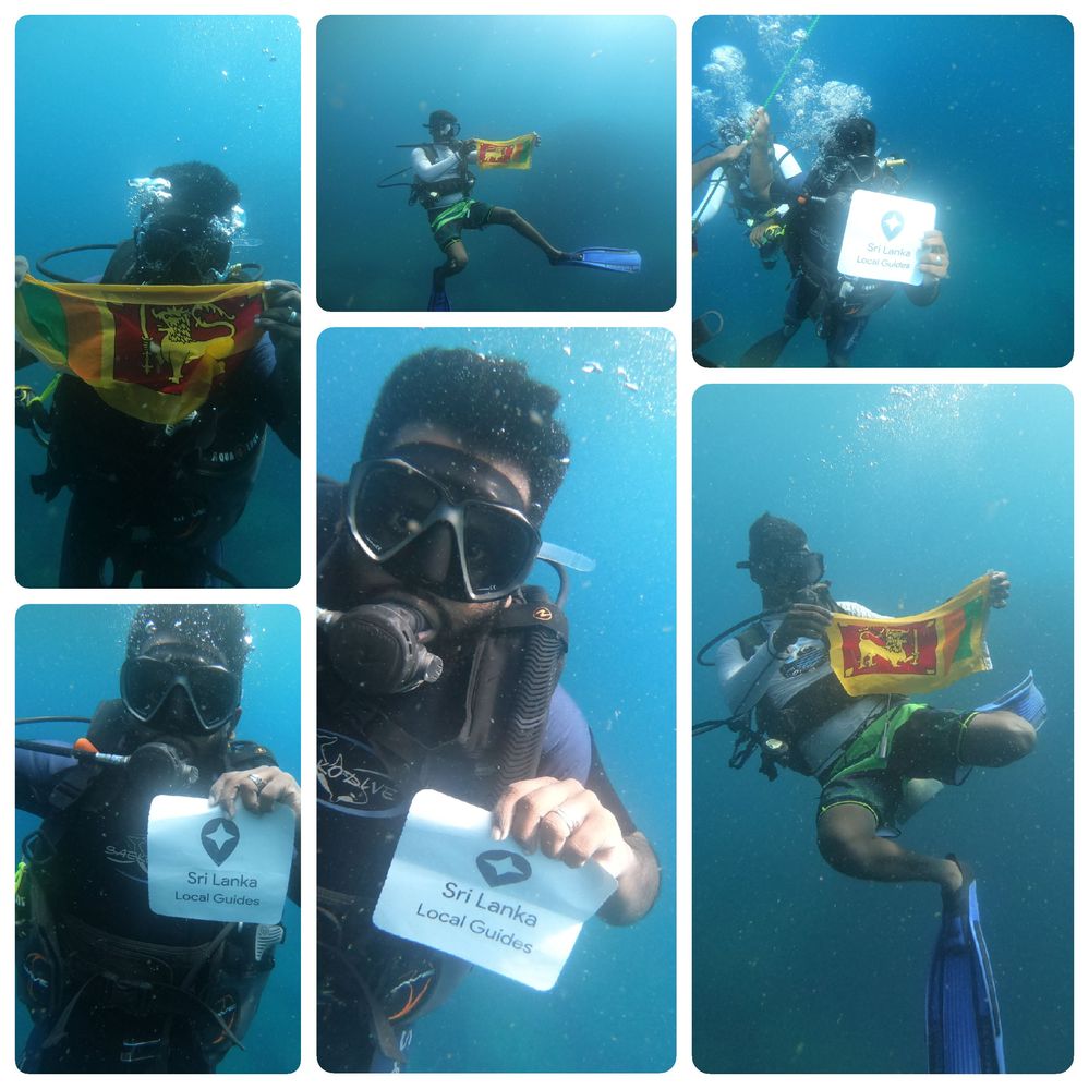 local guides showing national flag and a sign board  saying  "Sri Lanka local guides" while diving under water