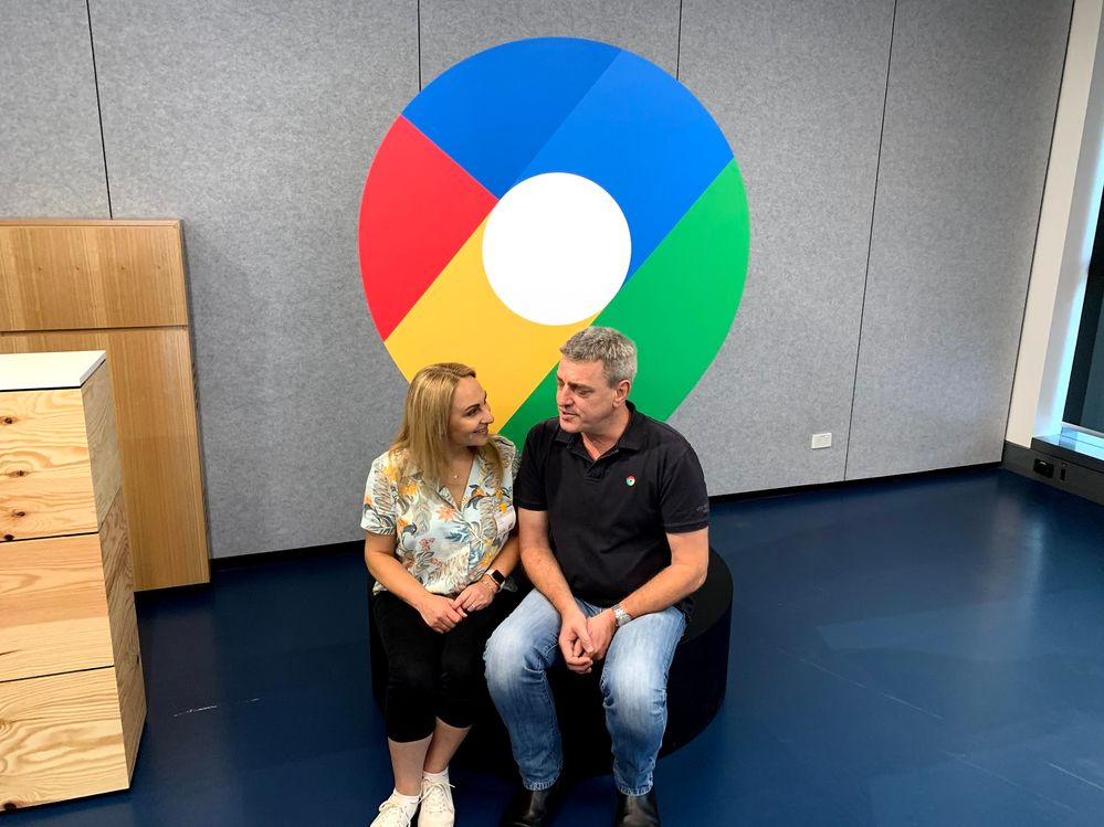 Local Guide Penny Christie and co-founder and software engineer of Google Maps, Noel Gordon sitting in front of the new Google Maps logo during Google Maps 15 birthday media conference at Google HQ in Sydney.