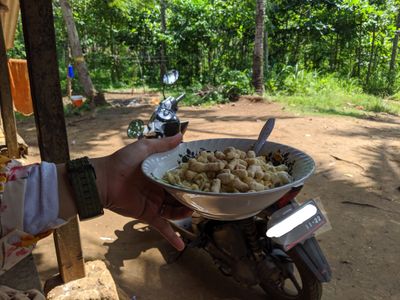 Caption: lunch with instant noodles during the touring by motorbike