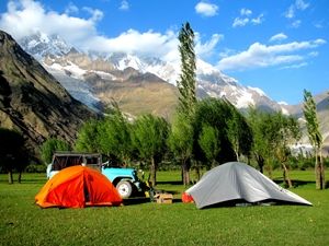 A tent house with jeep on the way to Shandur
