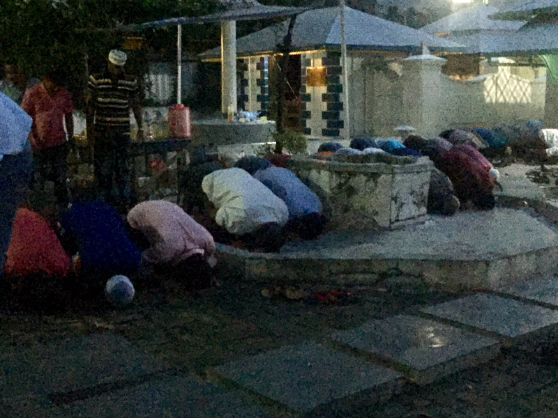 After Breaking fast, mosques are getting filled and people are praying outside the mosque.