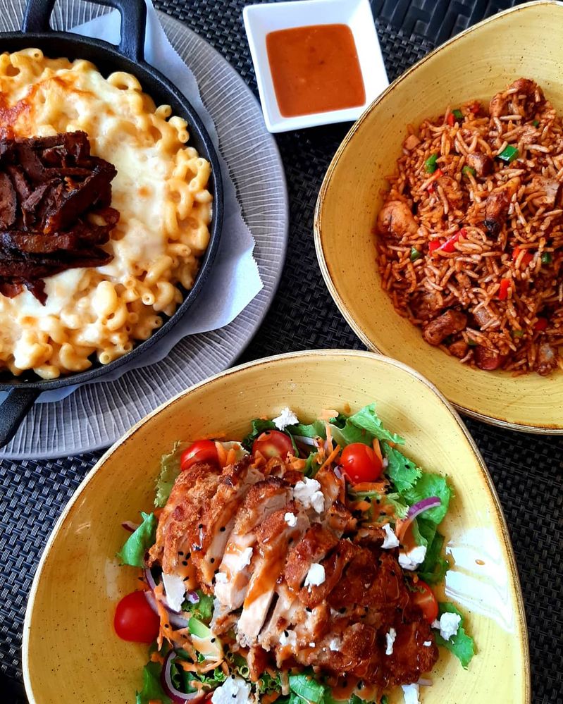 Caption: A trio of dishes from the Pavilion, Abuja. Pictured is the Short Rib Mac & Cheese, Crispy Chicken salad and West African Jambalaya. (Local Guide Zino_)