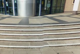 Horizontal lines such as stairs and fences across the two lenses betray stitching