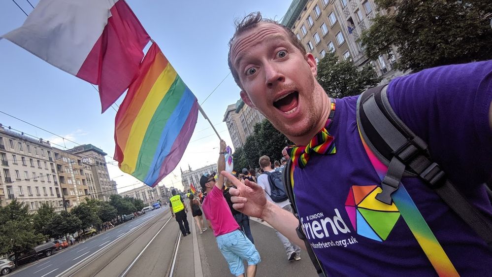 Caption: A photo of Daniel Reimer participating in a past Pride parade in Warsaw, Poland. (Local Guide Daniel Reimer)