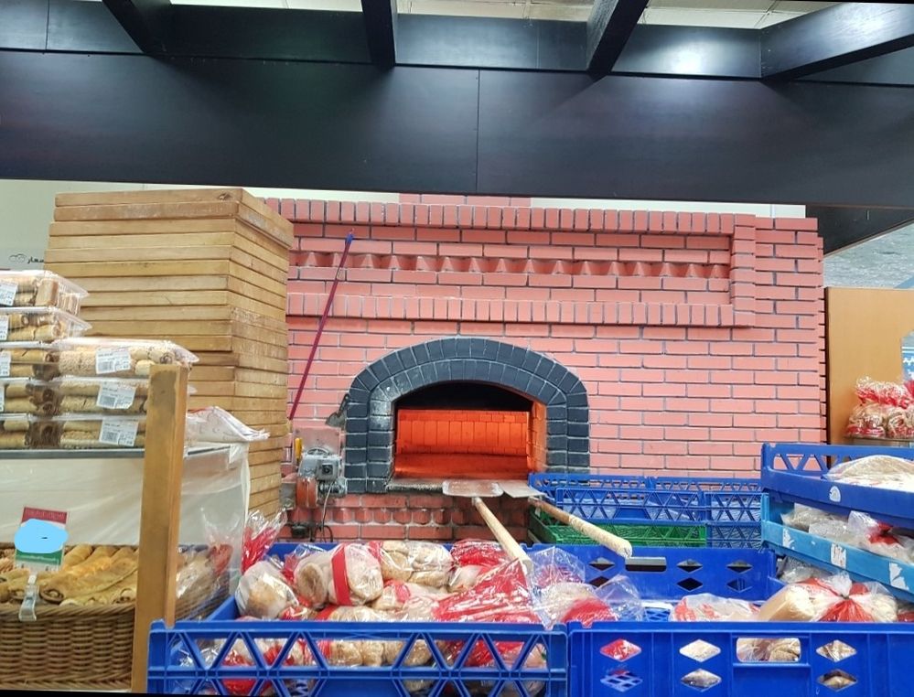 Masonry Oven in a local supermarket preparing fresh Khubz (I used a marker to hide the price of the bread)